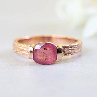 Faceted ruby ring in 18k rose gold band
