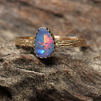 Australian opal engagement ring with 22k gold band